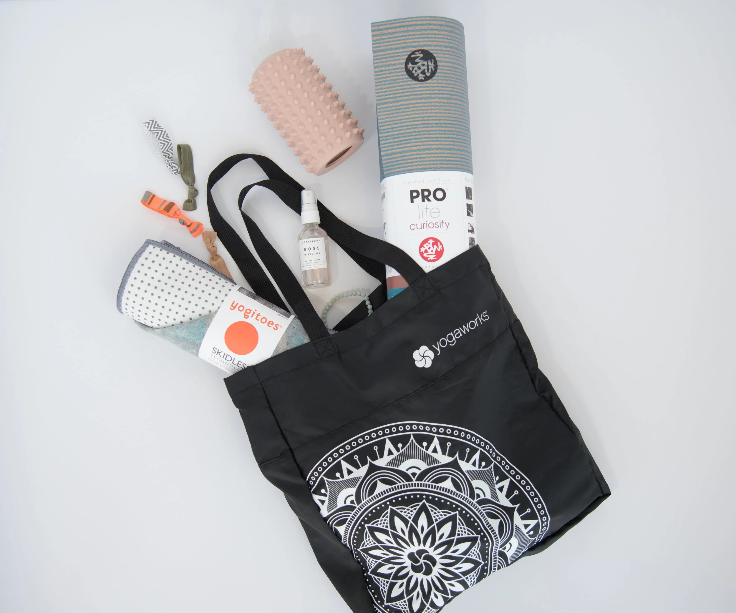 YogaWorks branded tote and mat packaging